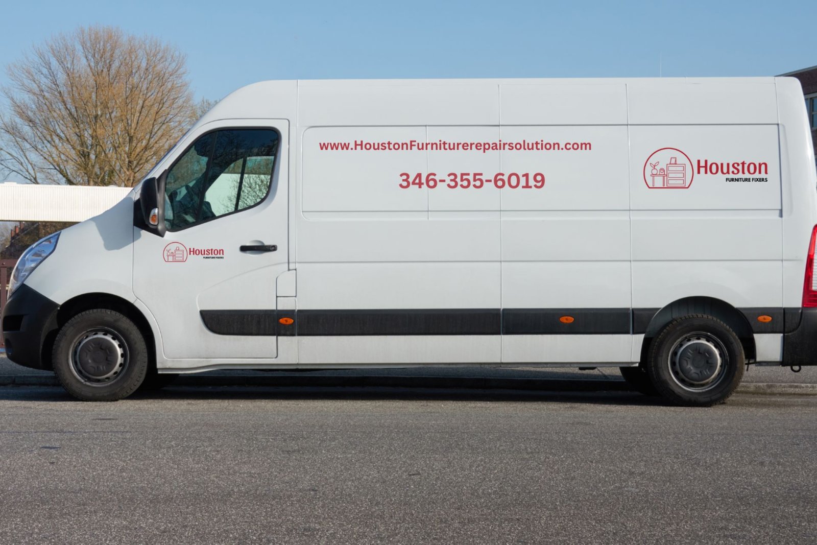 White van displaying "Houston" logo and contact details, parked on a street in front of a building.